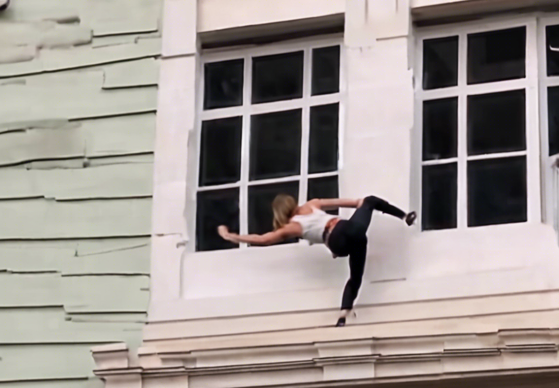 Viral Video: Woman Climbing out of Window